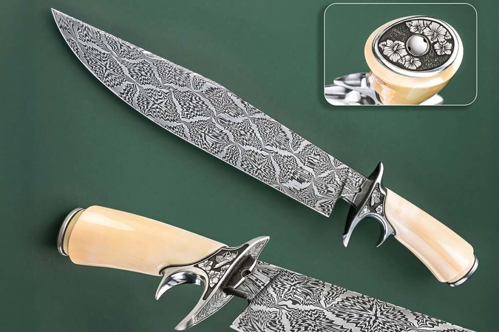 ABS master smith Andrew Meers calls his 16.5-inch sub-hilt fighter Bees and Flowers, due in no small part to the Rose of Sharon and bees engraving. The 12-inch blade is a damascus of 1084 carbon and 15N20 nickel-alloy steels in a mosaic pattern. Guard and furniture are 416 stainless steel. Overall length: 16.5 inches. (SharpByCoop knife image)