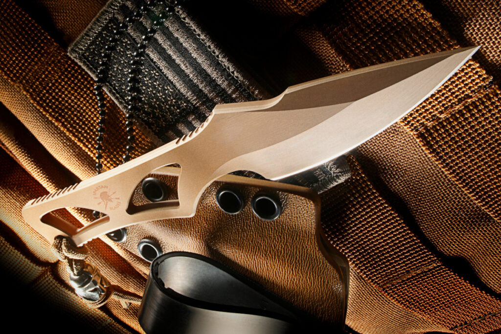 Arched/rounded handle cutouts can add torsional strength as seen on the Enyo by Spartan Blades.