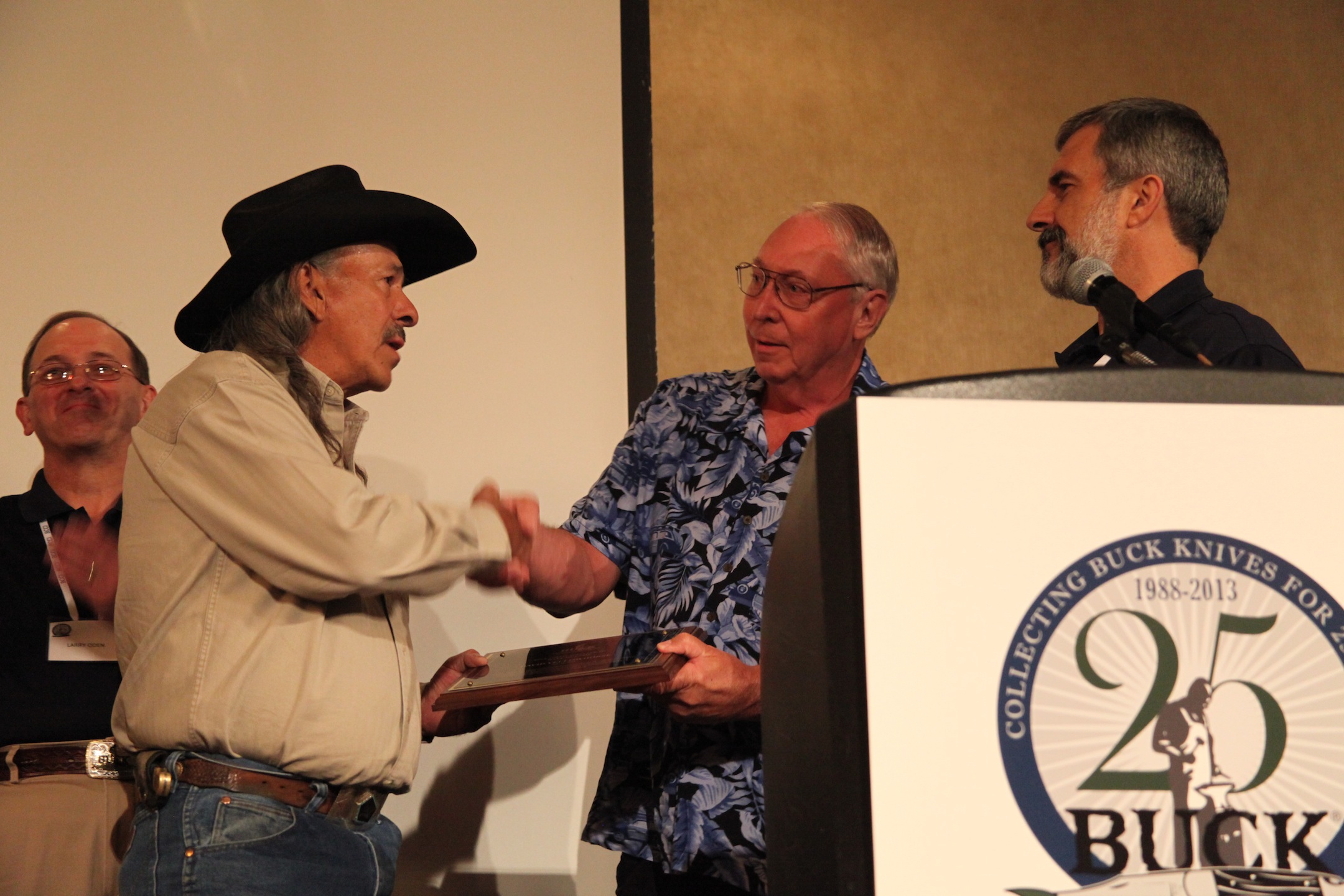 David Yellowhorse enters the Buck Collectors Club during the Buck Collectors Silver Anniversary gala. From left: Larry Oden, David Yellowhorse, Gene Merritt and John Foresman.