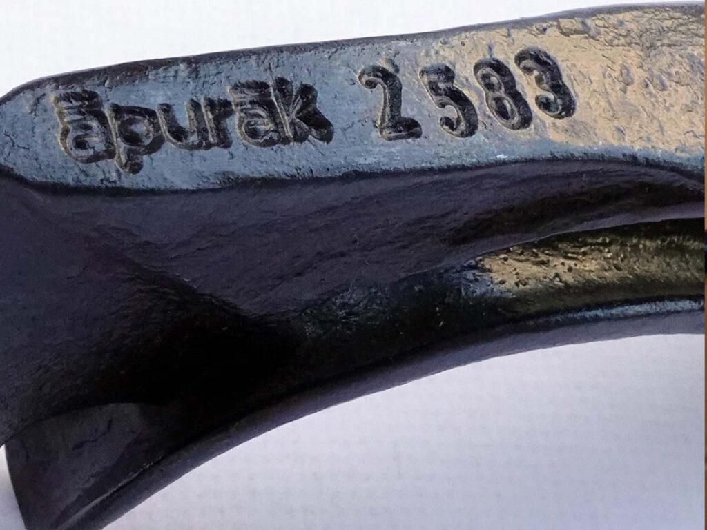 Masoud Hashemabadi maker's mark, Apurak. The word is from Middle Persian and means "The Maker." The numbering, seen on the spine of his work, is the year it was created according to the Cyrus Imperial Calendar.