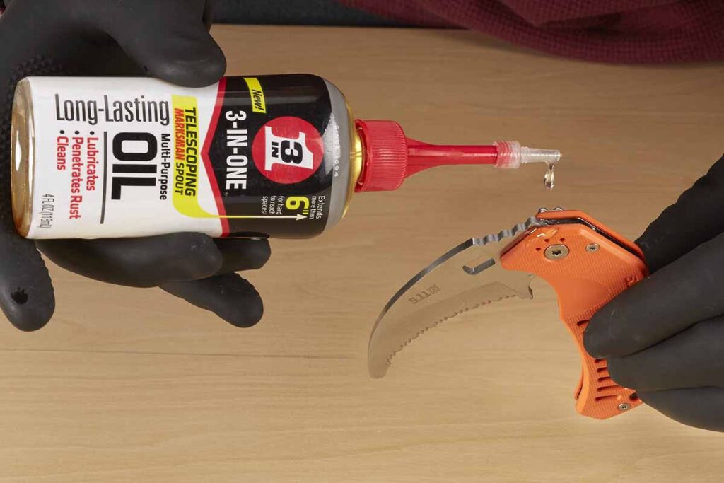 3-in-One Multi-Purpose Oil lubricating a knife.