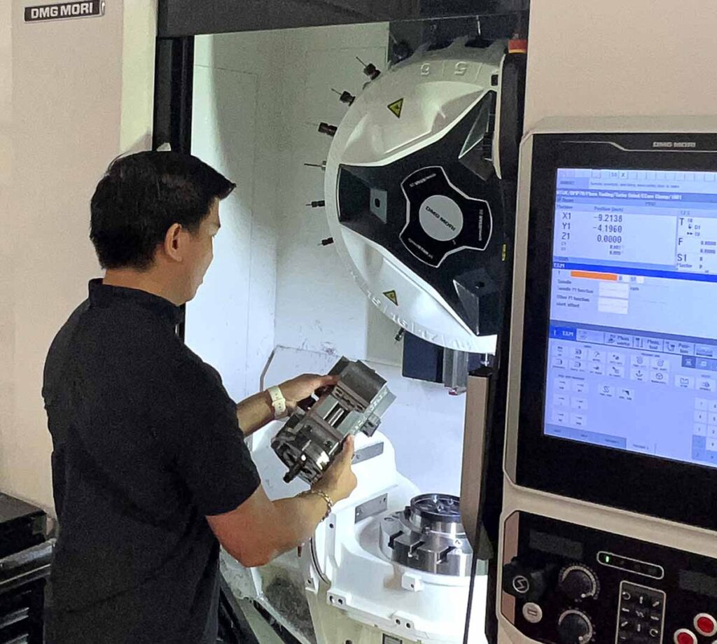 Princeton Wong operates the CNC mill. It can cut complex 3D