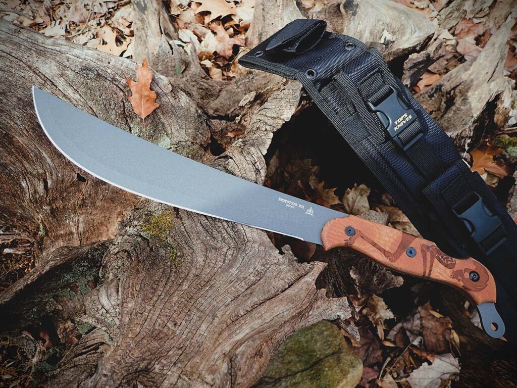 The TOPS Knives Sneak Reaper features an 18.5-inch length and a fast-moving 12-inch blade, designed for tight brush.