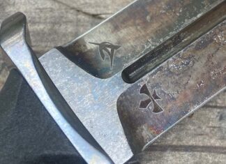 The logos of both makers appear on the blade above the ricasso of an EGA Dagger—Elishewitz at right and George at left.