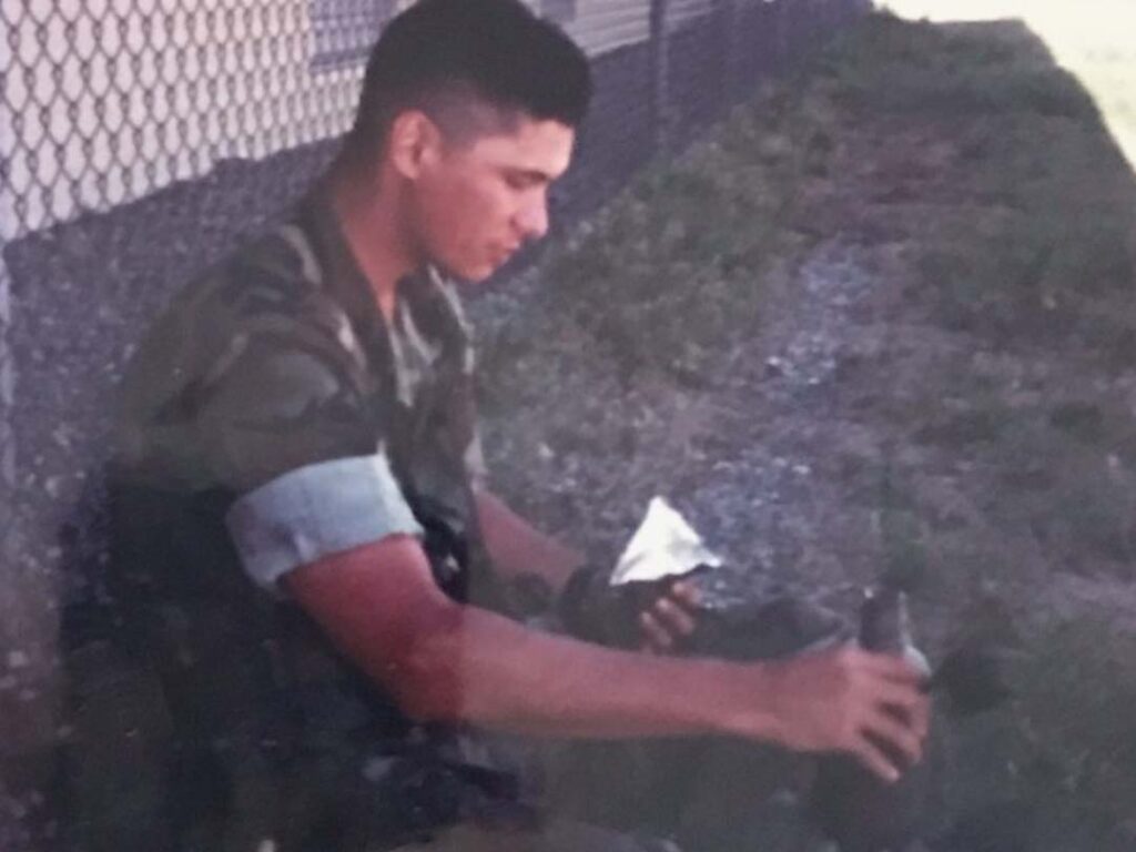 USMC Sergeant Allen Elishewitz takes a lunch break outside a Marine facility in the early ’90s.