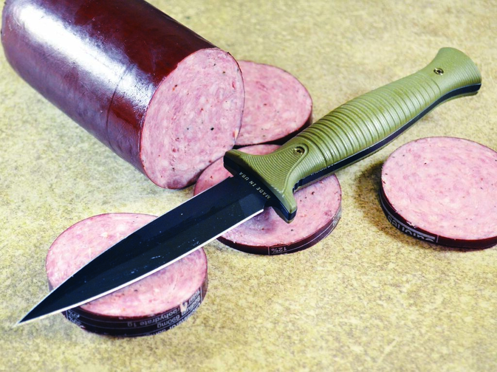 The Montana Knife Co. V24 stiletto turned out to be a little carnivore during testing. After doing stab tests on a chub of summer sausage proved a walk in the park, the author turned the slim 4-inch CPM MagnaCut blade to taking off slices of the meat. Note the clean edge work on the sausage casings.
