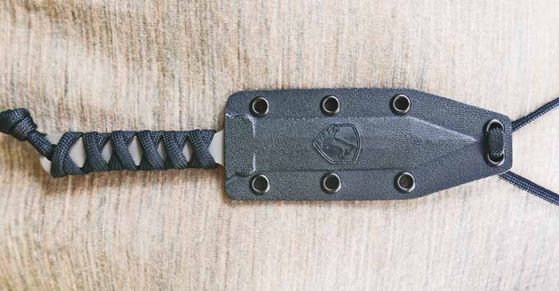 The black Kydex sheath of the Neck Gladius includes a suitable length of paracord for neck wear.