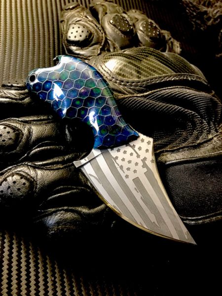 This Black Widow neck knife comes with American flag etching on both sides.