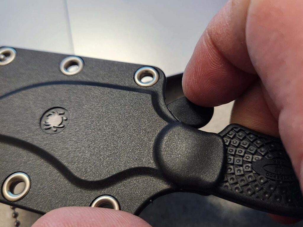 The Ark's sheath comes with a lock to ensure the knife safely stays put. It’s easy enough to disengage, placing minimal pressure on the tab to release the knife.