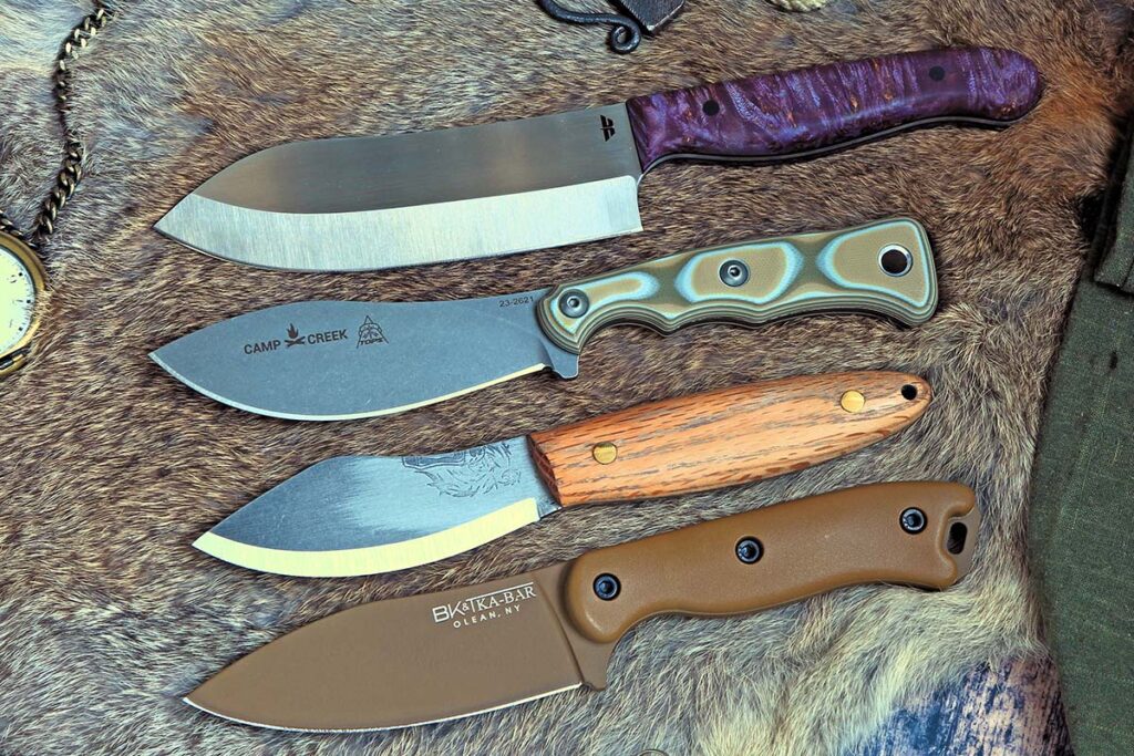 Nuge Camptoku, TOPS Knives Camp Creek, Bear Forest Knives PuuMuk and KA-BAR/Becker BK-19 Nessmuk knives.