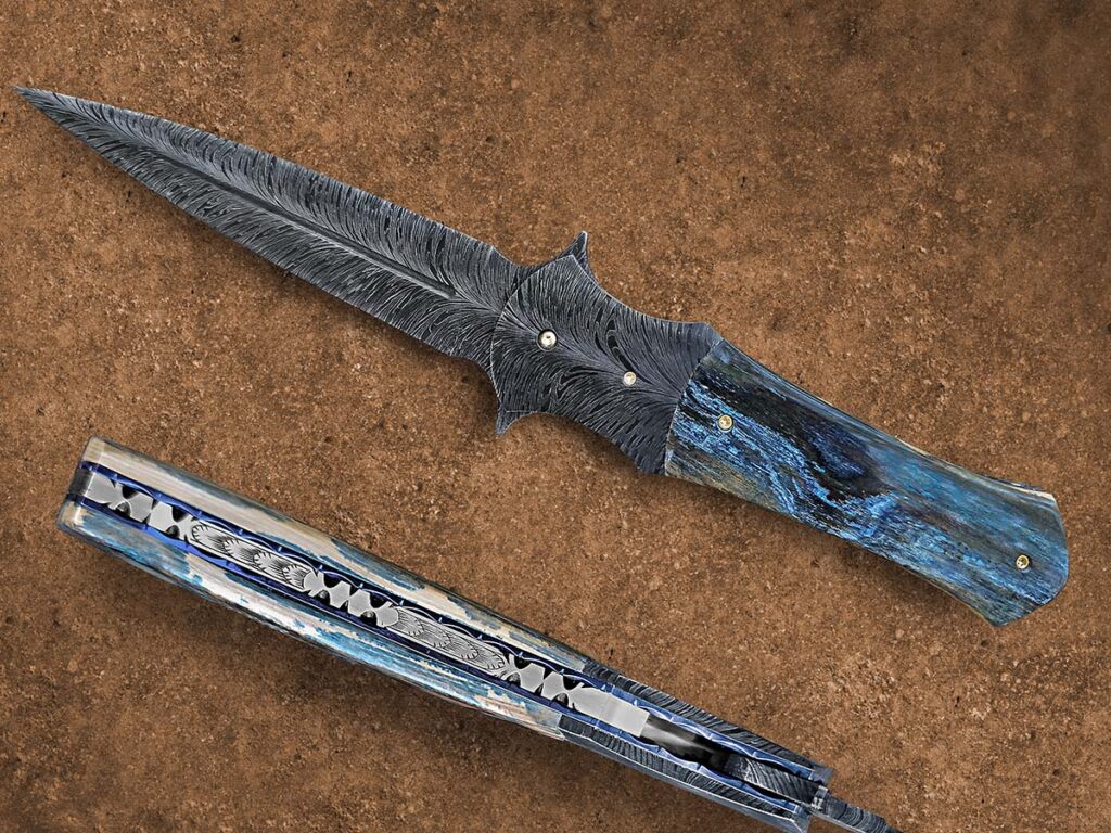 Bill Burke indicated a well-done feather pattern will have a flow from end to end with nicely curved veins. ABS master smith Scott Gallagher nails the concept in the feather-pattern blade of his Dolan Dagger Folder. Closed length: 5.25 inches. (Jocelyn Frasier image)