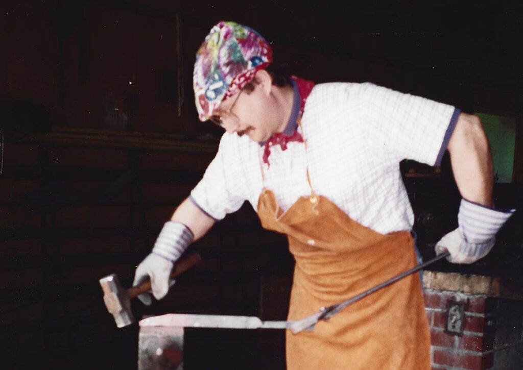Cutlery Hall-of-Famer Bruce Voyles hammers hot steel during a basic bladesmithing course in 1994 at the Bill Moran School of Bladesmithing. (B. R. Hughes image)