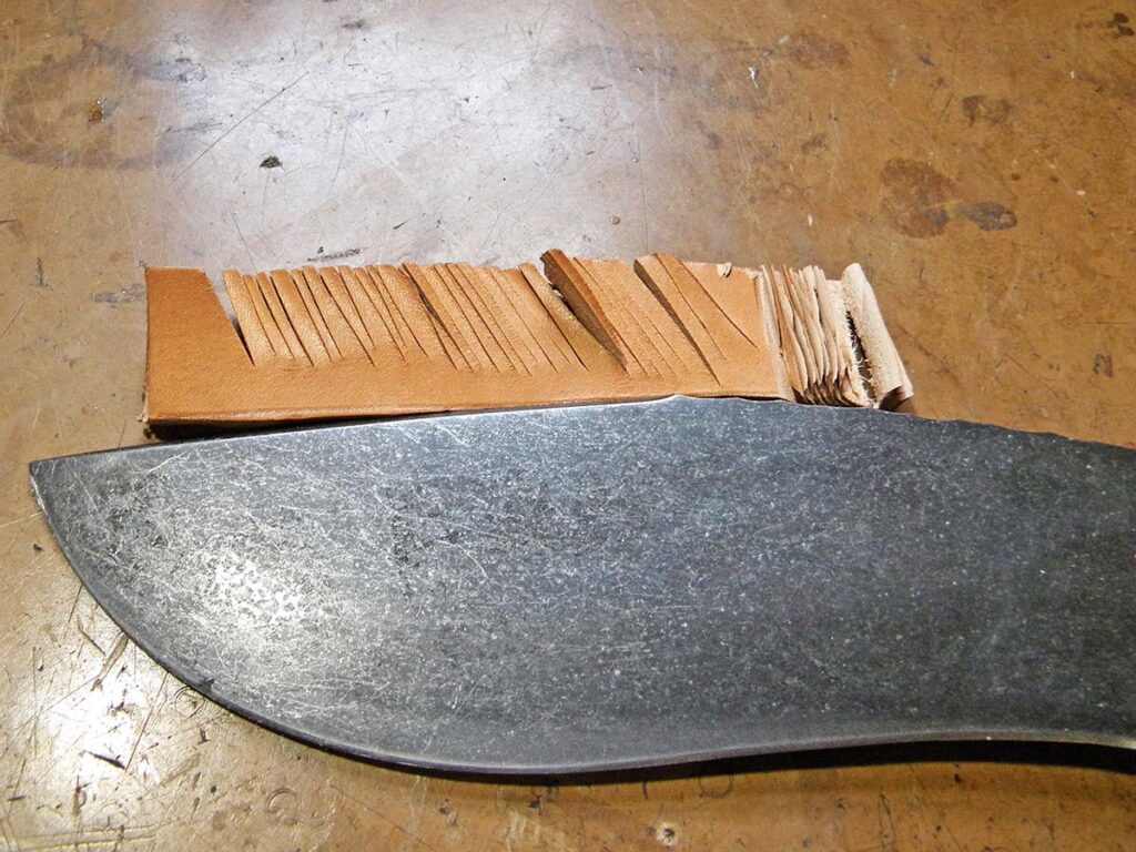 The Kukri smoked the leather cut.