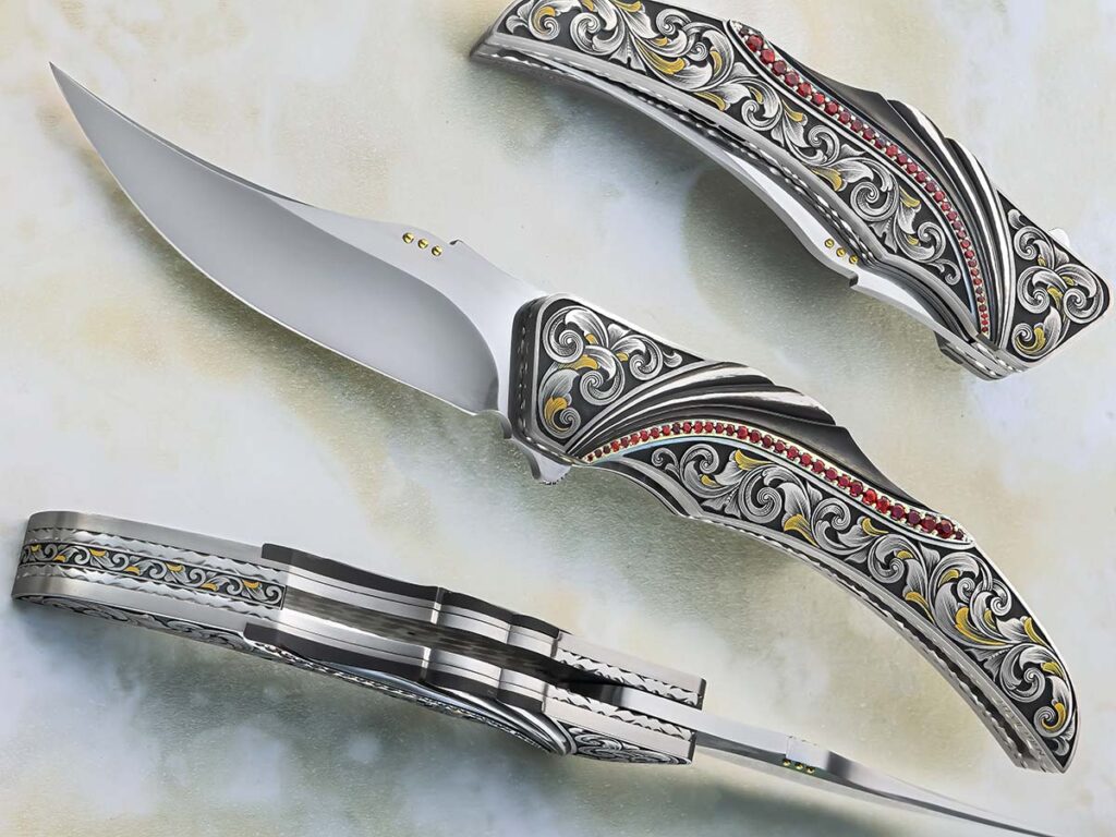 Engravers may need a year to finish an ongoing project before they can accept your order. As a result, get your name on the list with others waiting for an engraver to work out a design for your project. The engraving on a Herucus Blomerus folder is by Henk Viljoen. (SharpByCoop image)
