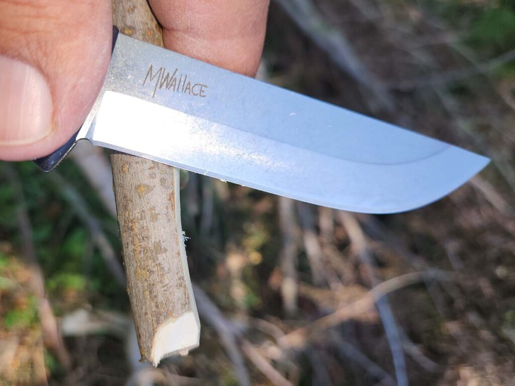 From this point, you can see the secondary bevel on the APOC. It’s not a Scandi grind but is still a good cutter.