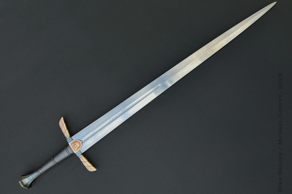 If the living room has a fireplace mantle, it’s a great place to display a custom sword. If you’re feeling medieval, the author recommends something like a hand-and-a-half piece by Ryan Breuer. (Ryan Breuer image)