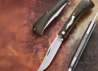Done in a bolsterless shadow pattern so the shield/silhouette of the F4 Phantom would fit well on the handle, the trapper by Phil Jacob and Ben Champagne for Rusty Preston features scales of a green Micarta® taken from a chafing block cut for an F4 Phantom jet—the same kind of aircraft Rusty flew as an Air Force pilot during the Vietnam War. Blade steel: CPM 154 stainless. (SharpByCoop image)