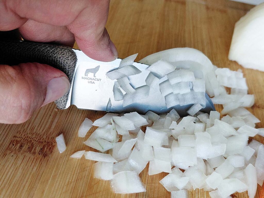 Sheepsfoot blades excel in the kitchen, similar to a santoku knife with a flat blade. The Circadian slices with authority, performing pull slices with the tip. 