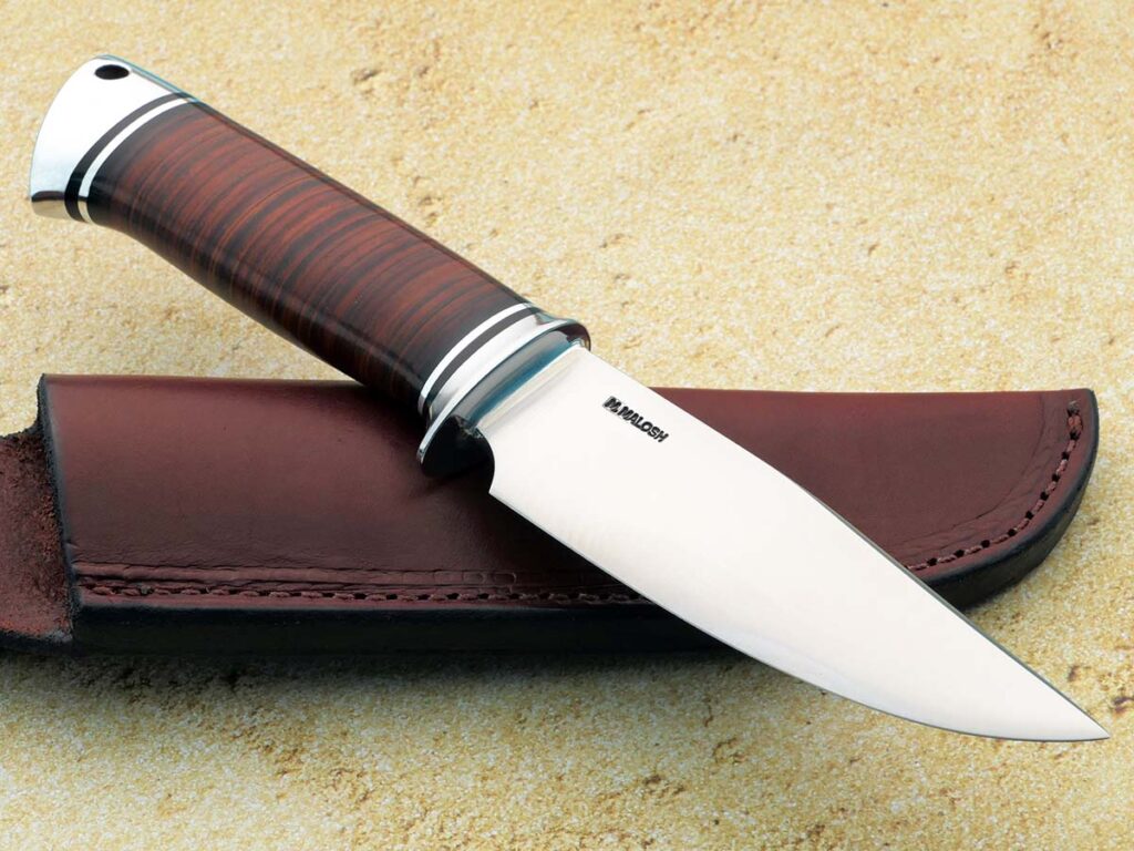 Beautifully spartan, Mike Malosh executes an extremely clean hunter that’s built for dead-serious work. (Robertson's Custom Cutlery image)