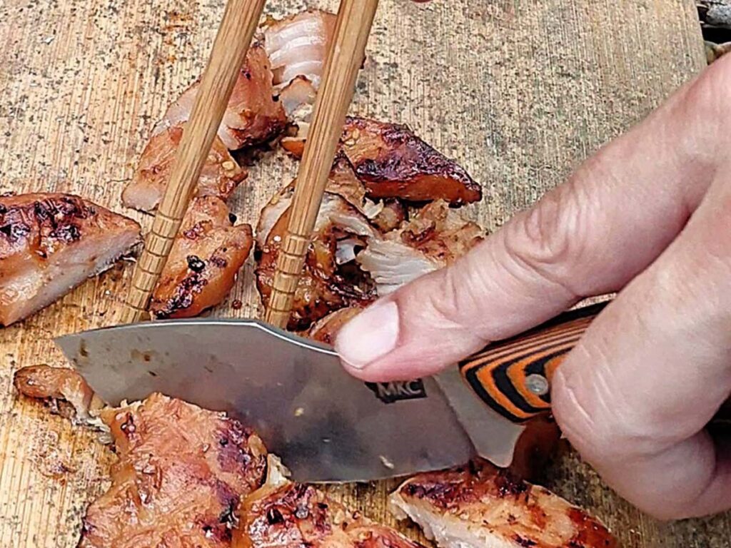 The author indicated the Packout Skinner would make Nessmuk proud. With a MagnaCut stainless steel blade and textured G-10 handle, it sliced through Teriyaki chicken like a champ.