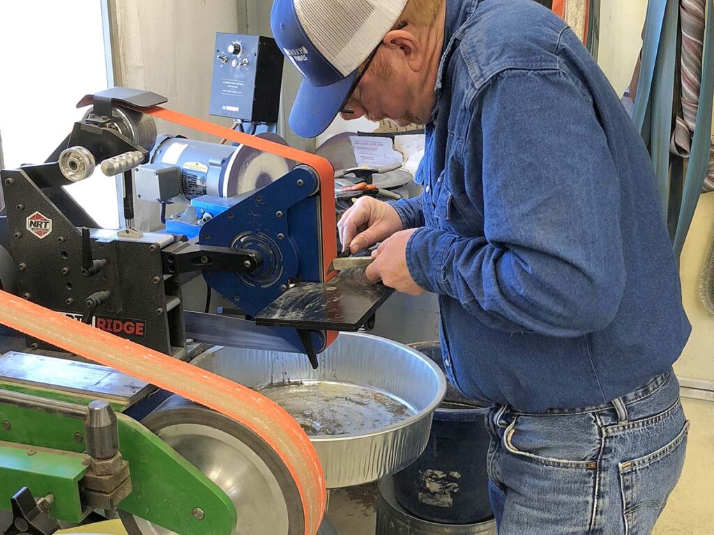 Bubba Crouch at his grinds a blade.