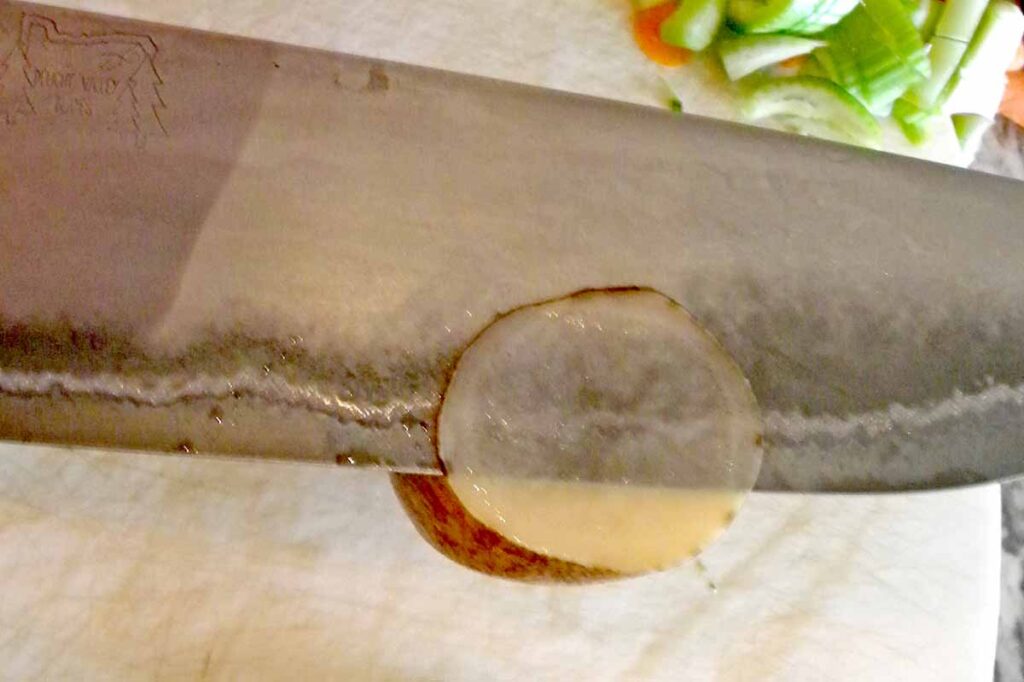 Veggie Slicer through a potato