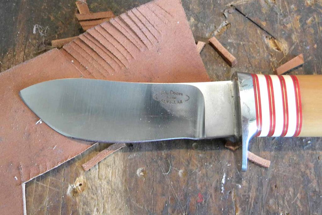 Dozier’s knife cutting leather