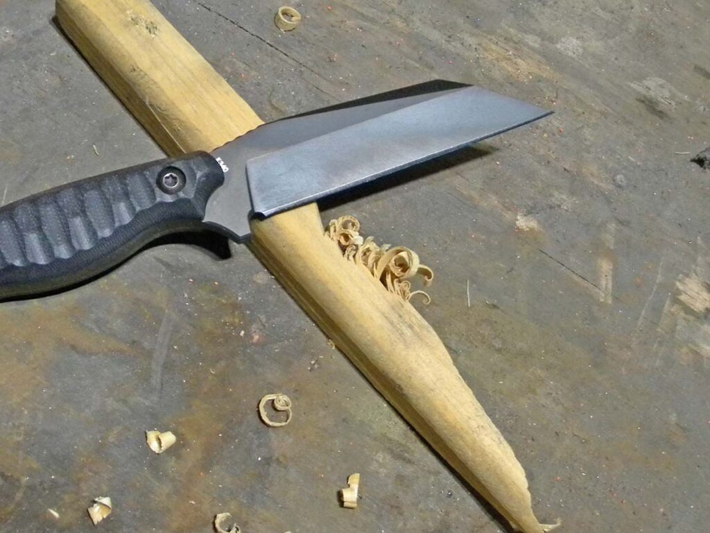 The knife had some nice attributes when challenging tougher materials, such as this pine. The author was able to exert more force when creating curly cues thanks to a smartly placed thumb notch on the spine.