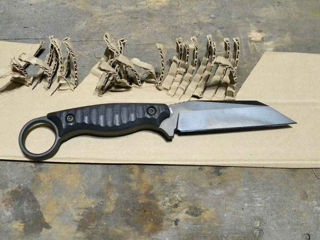 Cardboard did curl, but the author didn’t chalk that up to issues with the knife’s hollow grind. Instead, it was more a factor of the knife’s thickness binding on cuts through the stiffer material.