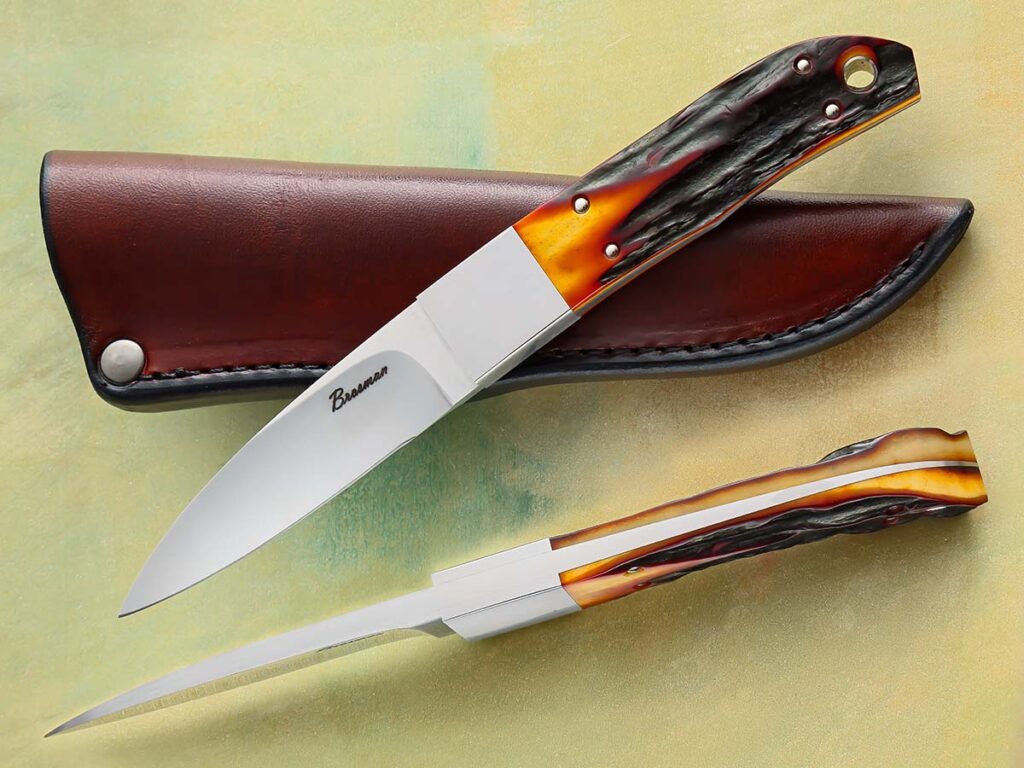 Among custom knifemakers especially, CPM 154 stainless is extremely popular. Craig Brosman employs it in a hollow grind and amber-dyed European red stag on his utility fixed blade. Overall length: 7.5 inches. (SharpByCoop image)