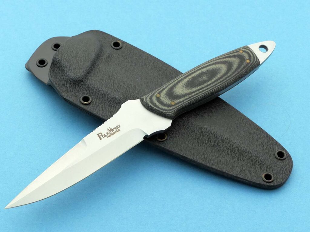 Finger/thumb serrations on the blade spine of Al Polkowski’s Boot Fighter help with controlling the knife in use.