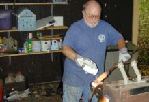 In his final years of knifemaking, Tim—inset applying flux to twisted steel in his forge.