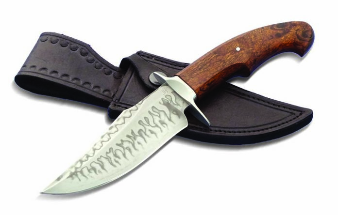 Very popular in his home country of Slovakia, Jan Hafinec outfits his custom utility hunter in a 5-inch blade of forged C105 carbon steel sporting a flashy double hamon. Handle: presentation desert ironwood. Guard and sub hilt: stainless steel. Overall length: 10 inches. Sheath: by the maker and of leather. Maker’s price for a similar knife: $699. (Impress By Design image)