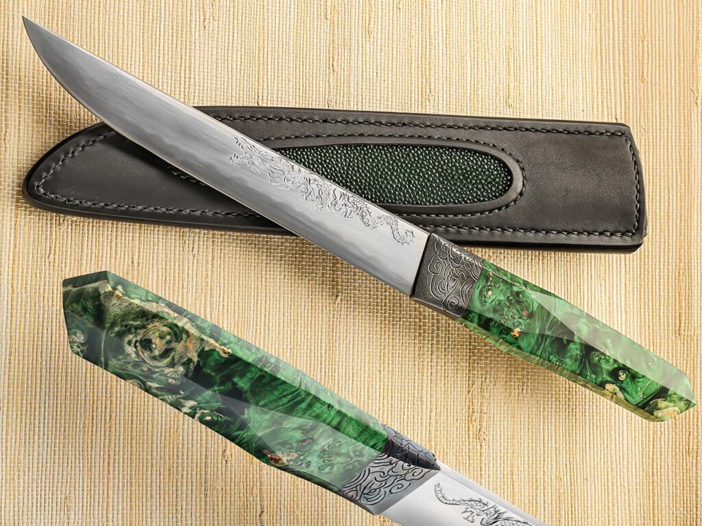 The traditional handle of Dew Hara’s suigetsu has stabilized burl scales and a copper bolster. The 7-inch blade is tamahagane steel with a hamaguri grind. Overall length: 12.4 inches. (SharpByCoop image)