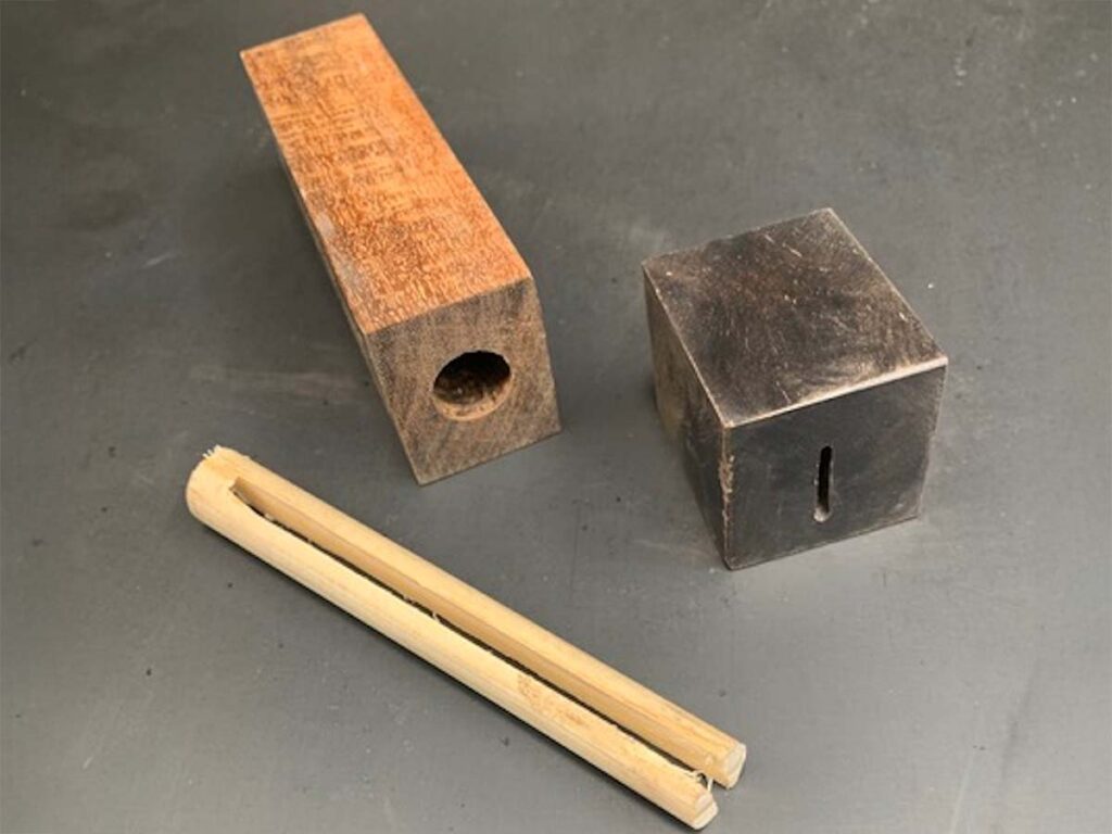 The wa handle of Mert Tansu’s gyuto has a half-inch-wide, 4-inch dowel (above) with a tang slot cut into it. “It is a traditional-shaped wa except for the internal structure,” Mert wrote. “While most Japanese blades are mounted to the handle with burning the tangs in, this is not possible with a hard timber-like ringed gidgee, and I glued mine in.”