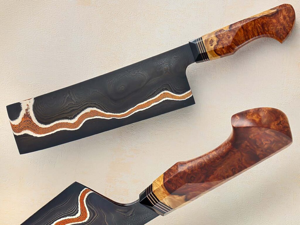 One of the unique advantages of the cleaver, Dan Tomplins points out, is the large canvas it allows for the steel. In the case of his nakiri—vegetable cleaver—its 81/2-inch copper mai blade can’t help but catch the eye, particularly with the steel’s blacked-out finish enhancing the patina'd copper. Note too, the hybrid octagonal/western-style handle made from amboyna burl. (SharpByCoop image)