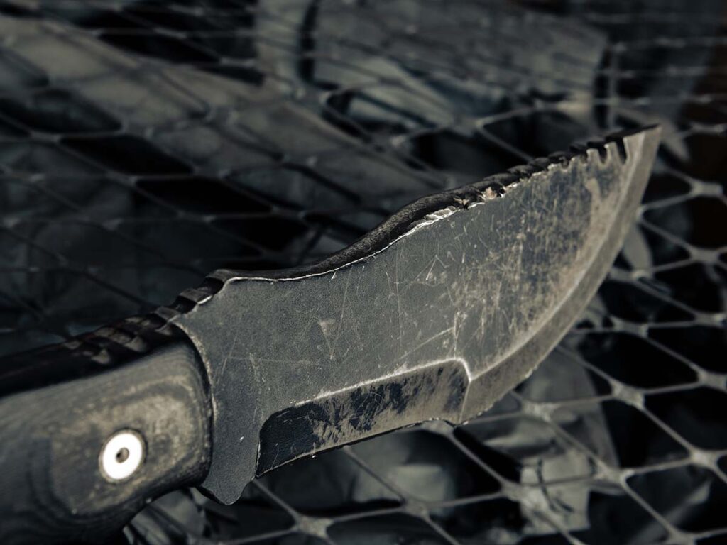 Back to the TOPS Tom Brown Tracker that was lost in the Iraqi IED incident: the local who originally found it after the explosion used it to split wood. The saw teeth had basically been mushroomed out of existence from the local beating on the knife with a piece of metal. Considering how the U.S. serviceman originally lost the knife, TOPS fulfilled the warranty.
