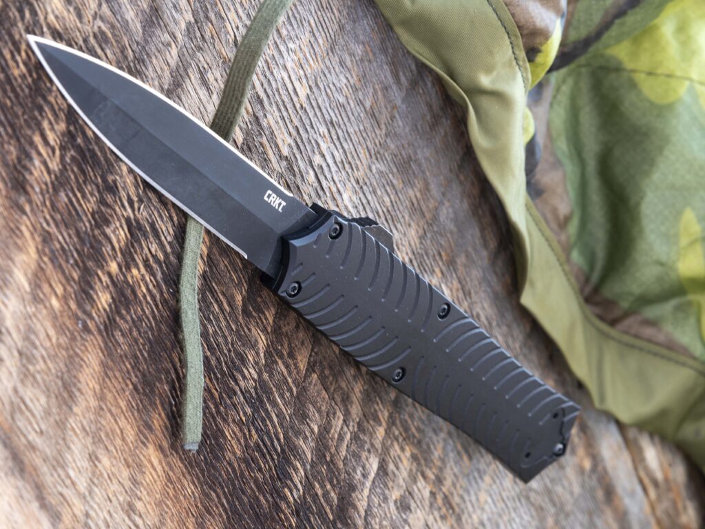 The points at the ends of the CRKT Xolotl OTF handle not only add visual style but also allow the knife to be used as a non-lethal defense striking tool when the blade is retracted into the handle.