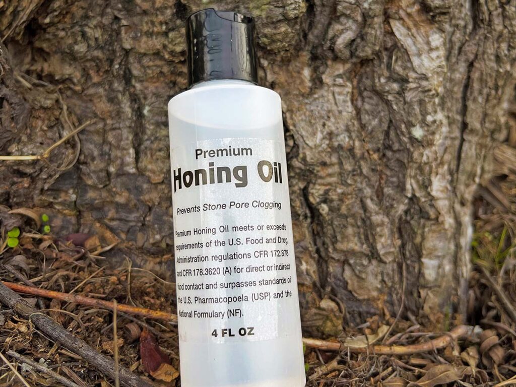 Among the most critical factors of using natural stones to sharpen knives is using honing oil. Oil keeps metal particles, or swarf, from clogging the stone’s natural pores, thus reducing its effectiveness. (Image courtesy of Chris Stillian)