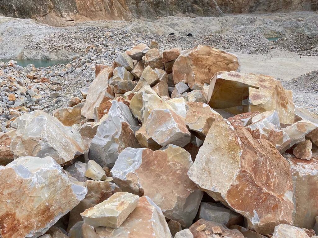 The novaculite deposits in Arkansas were formed 318 to 416 million years ago and it takes plenty of mechanical muscle to push around the material. The deposits run from 200- to 900-feet thick, in turn the operations are substantial. And while the weathered novaculite is somewhat bland to the eye, once broken up the beauty of the natural material shines through. (Images courtesy of Chis Stillian)
