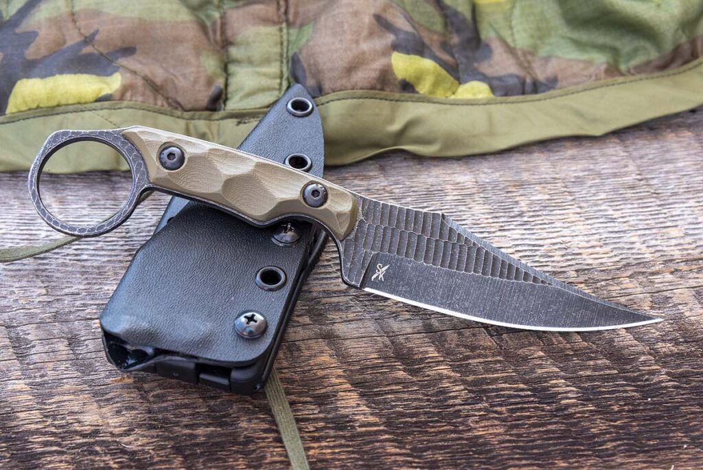 The HM1 from Stroup Knives showcases a prominent clip point blade and a sweeping cutting edge. Both help it excel in either defensive or conventional chores. As a bonus, the tip of the blade is so acute it tackles precise cutting chores with ease.