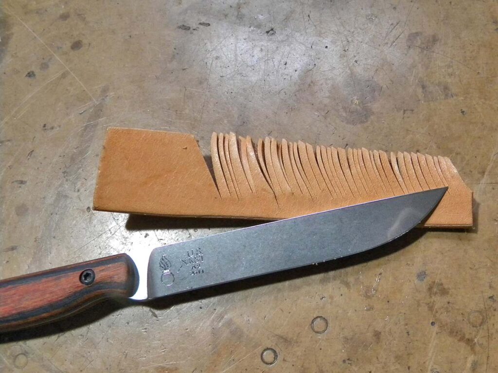 The author used vertical cuts on the 8-ounce leather as fast as he could. The edge bit swift and deep with a nice crunching sound.