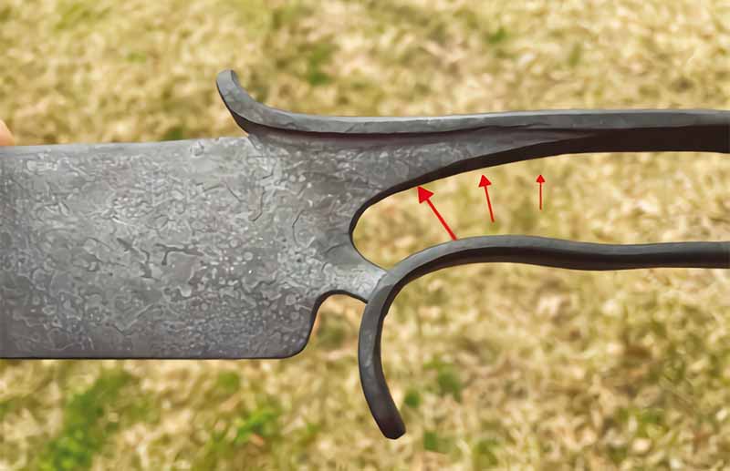 For those inclined to overthink a matter, look at the “T” cross section of the blade-to-handle transition. It eff ectively converts the stress loads in the needed directions.