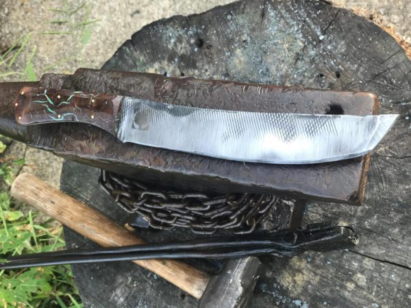 Buddy Thomas utilizes both frontier and post-apocalyptic styles in his knifemaking.