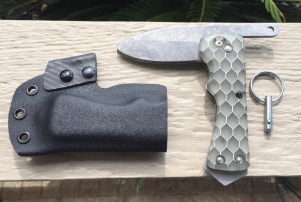 Denny Furey of Furey's Combat Knives - Unlimited made this blunt-tip rescue knife with grenade pull pin.