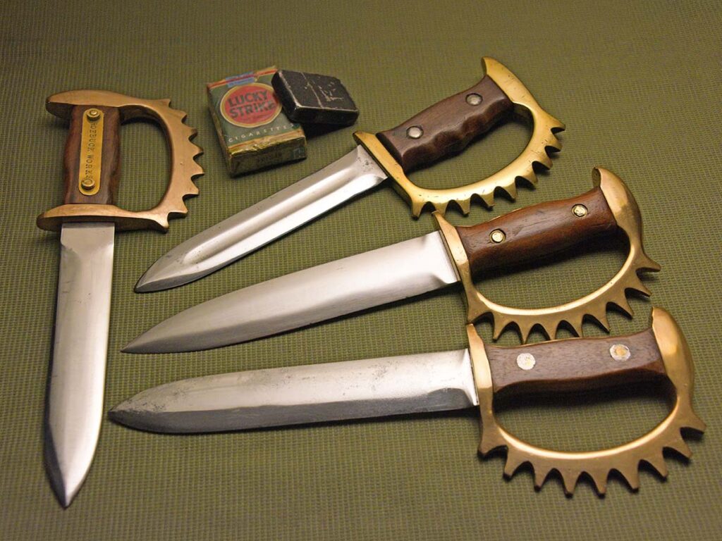 Howard Cole was famous for making knuckle knives such as these three rare nine-pointers and one eight-pointer. A paratrooper named Clyde McClelland carried the center nine-pointer during World War II. (Image courtesy of Louis Chow)